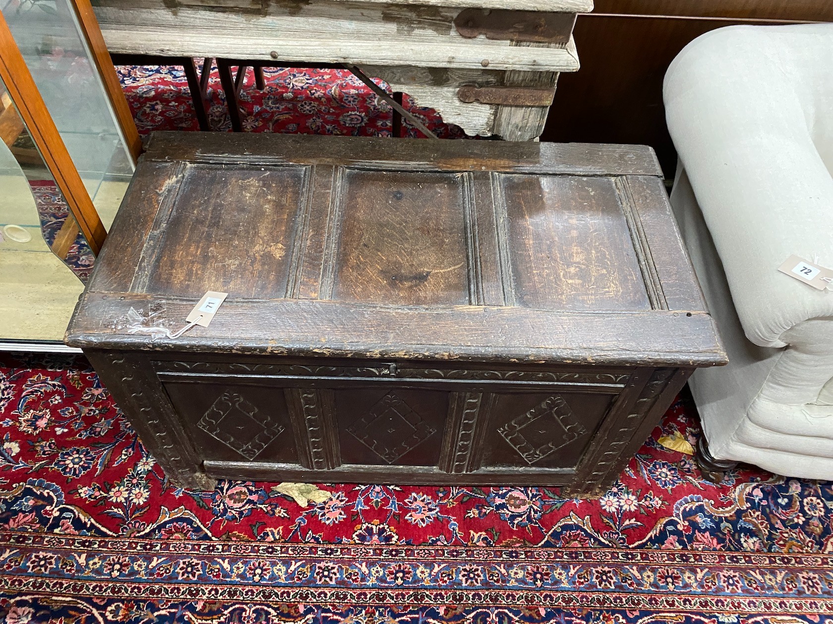 A 17th century carved panelled oak coffer, length 99cm, depth 50cm, height 58cm